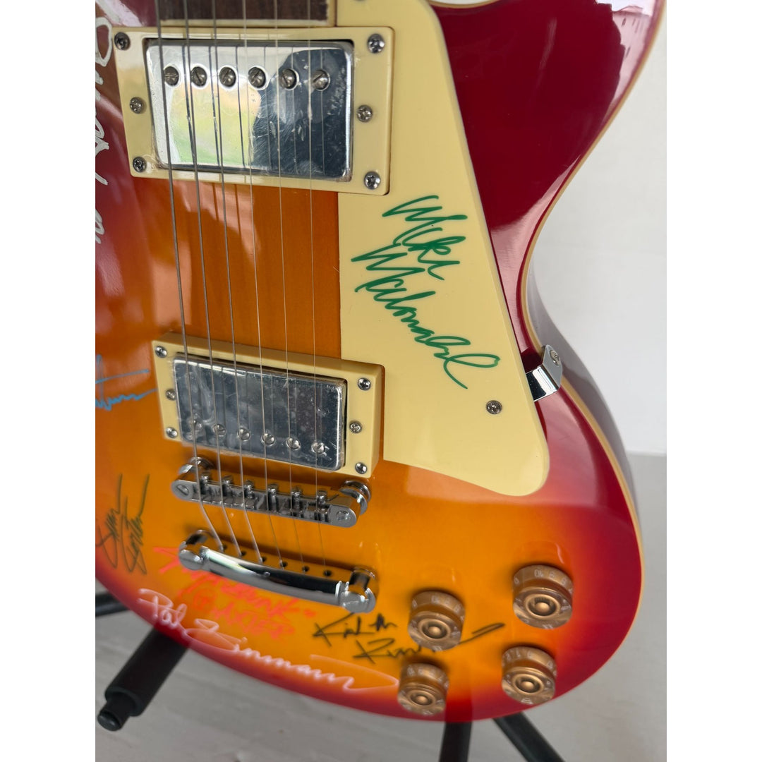 The Doobie Brothers Michael McDonald, Patrick Simmons, John McFee, Tom Johnston vintage Cherry Les Paul electric guitar signed with proof.