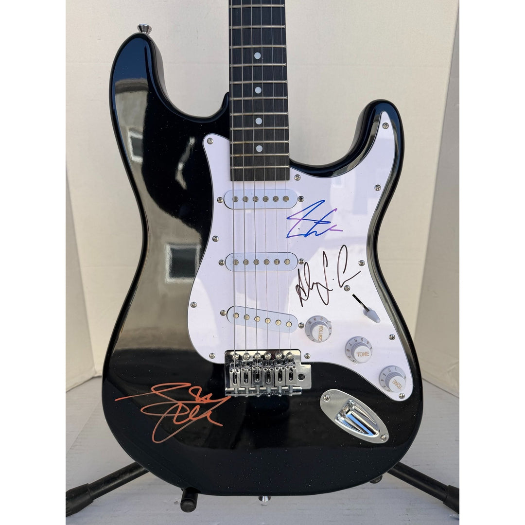 Geddy Lee Alex Lifeson Neil Peart Rush Stratocaster electric guitar signed with proof.