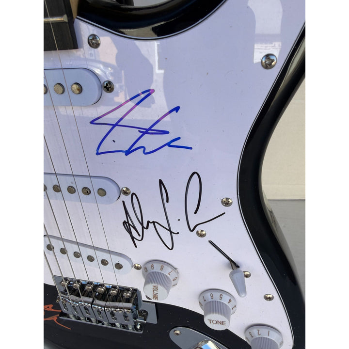 Geddy Lee Alex Lifeson Neil Peart Rush Stratocaster electric guitar signed with proof.