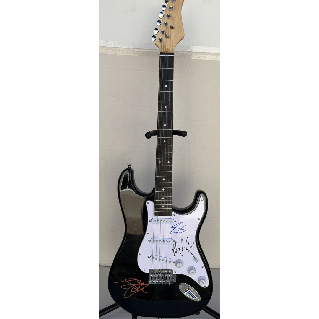 Geddy Lee Alex Lifeson Neil Peart Rush Stratocaster electric guitar signed with proof.