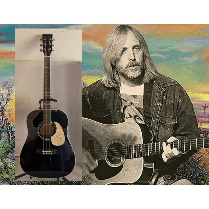 A black acoustic guitar beside a black-and-white photo of a person with long hair playing guitar.