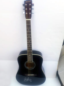 Waylon Jennings black acoustic guitar signed with proof