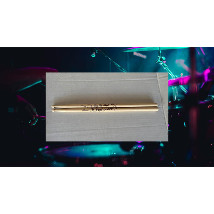 Tommy Lee of Motley Crue pair of drumsticks signed with proof.
