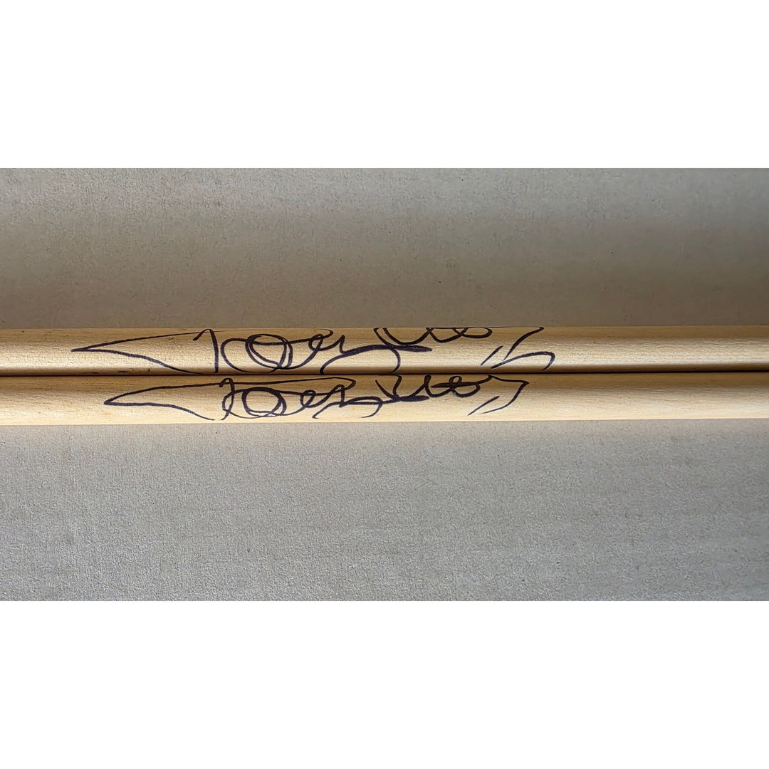 Tommy Lee of Motley Crue pair of drumsticks signed with proof.