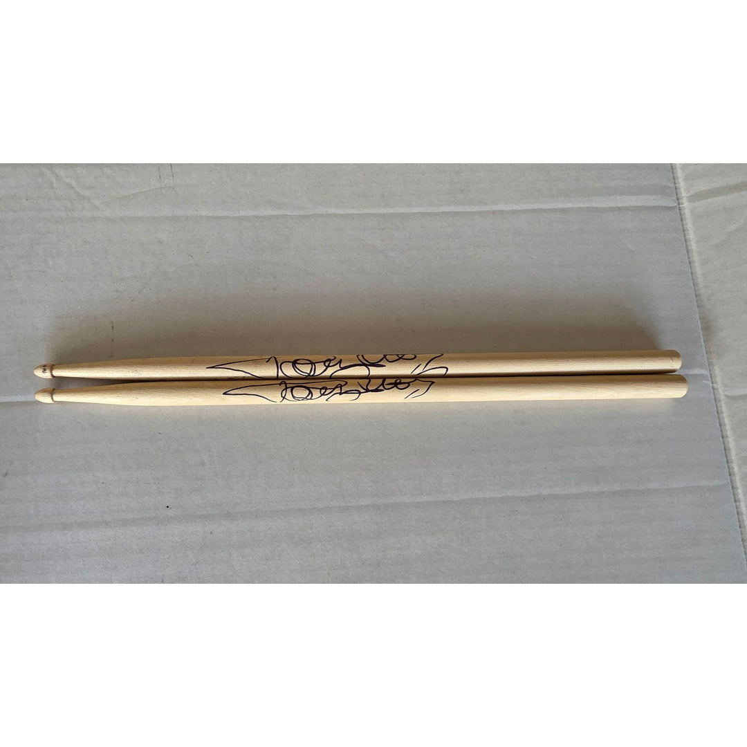 Tommy Lee of Motley Crue pair of drumsticks signed with proof.
