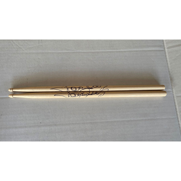 Tommy Lee of Motley Crue pair of drumsticks signed with proof.