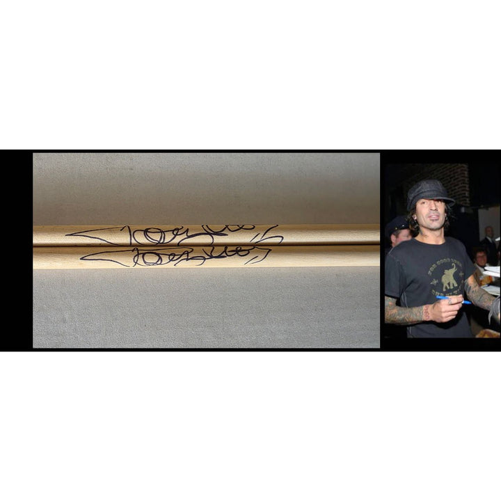 Tommy Lee of Motley Crue pair of drumsticks signed with proof.