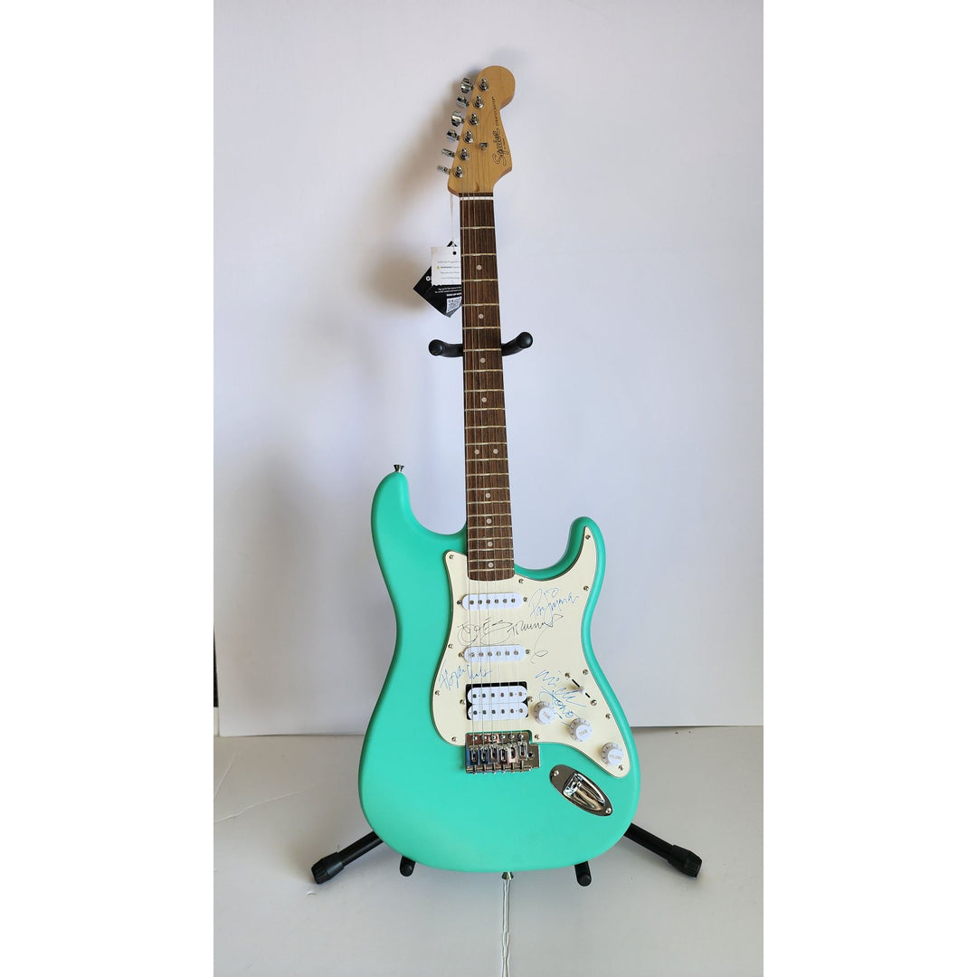 The Clash Mick Jones, Joe Strummer, Topper Headon, & Paul Simonon Fender Stratocaster electric guitar signed with proof