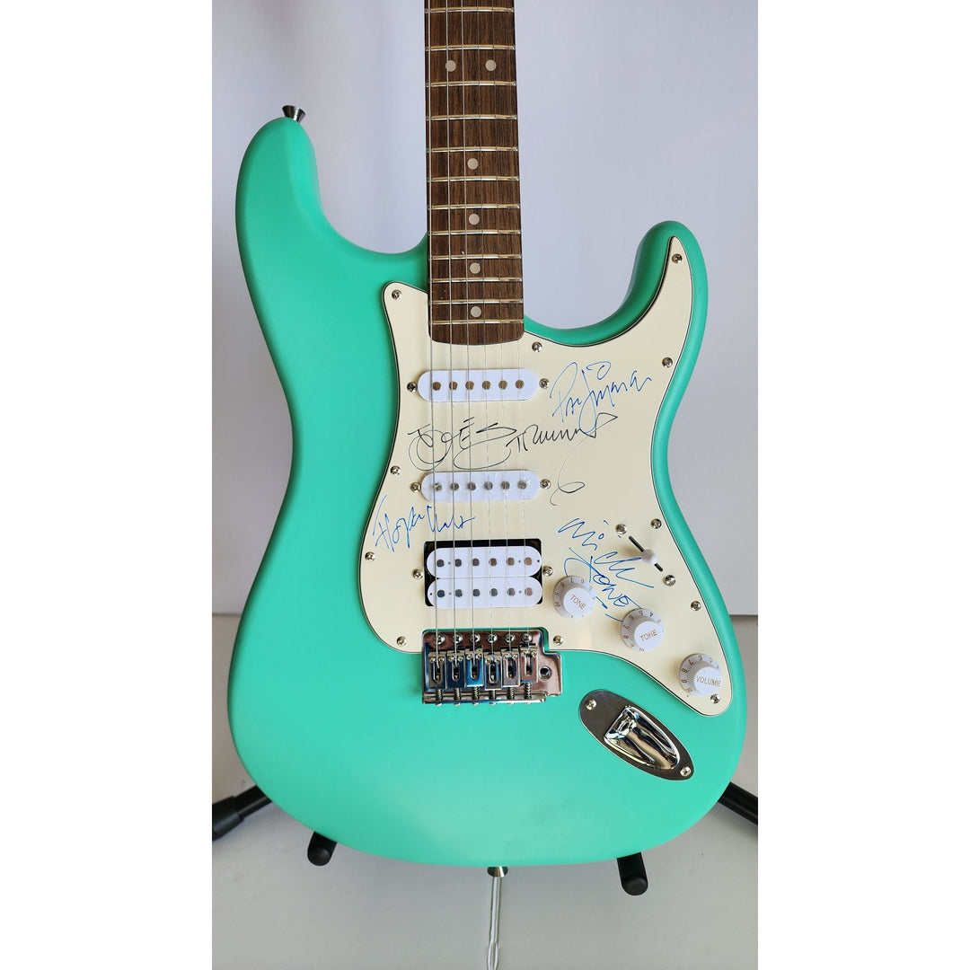 The Clash Mick Jones, Joe Strummer, Topper Headon, & Paul Simonon Fender Stratocaster electric guitar signed with proof