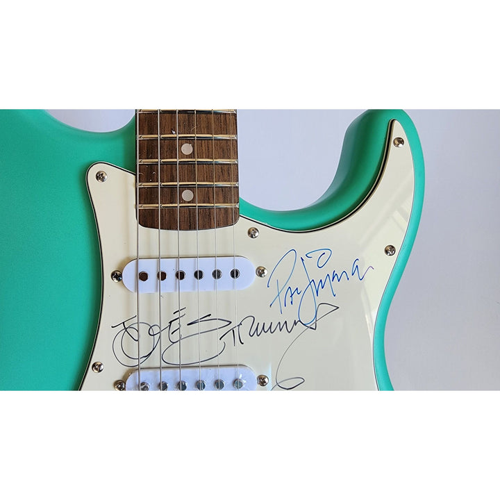 The Clash Mick Jones, Joe Strummer, Topper Headon, & Paul Simonon Fender Stratocaster electric guitar signed with proof