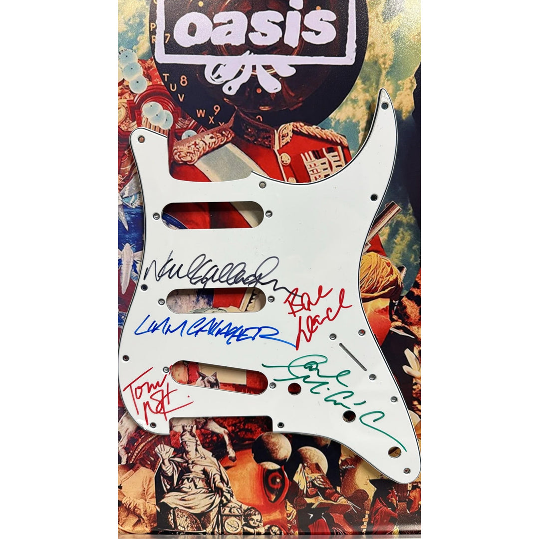 Oasis Alan White, Andy Bell, Gem Archer, Liam Gallagher, Noal Gallagher Fender Stratocaster pickguard signed and framed with proof