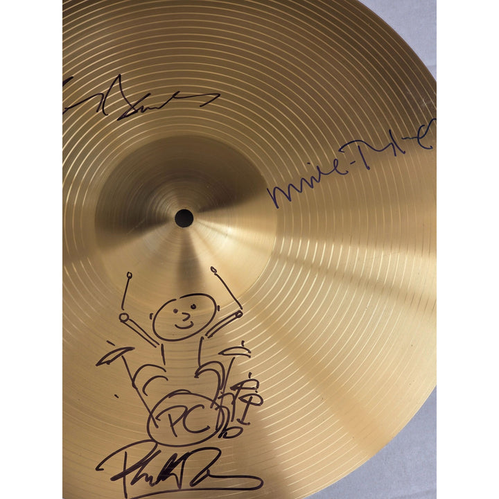 Genesis, Phil Collins, Tony Banks, Peter Gabriel, Mike Rutherford 16 inch cymbal signed with proof.
