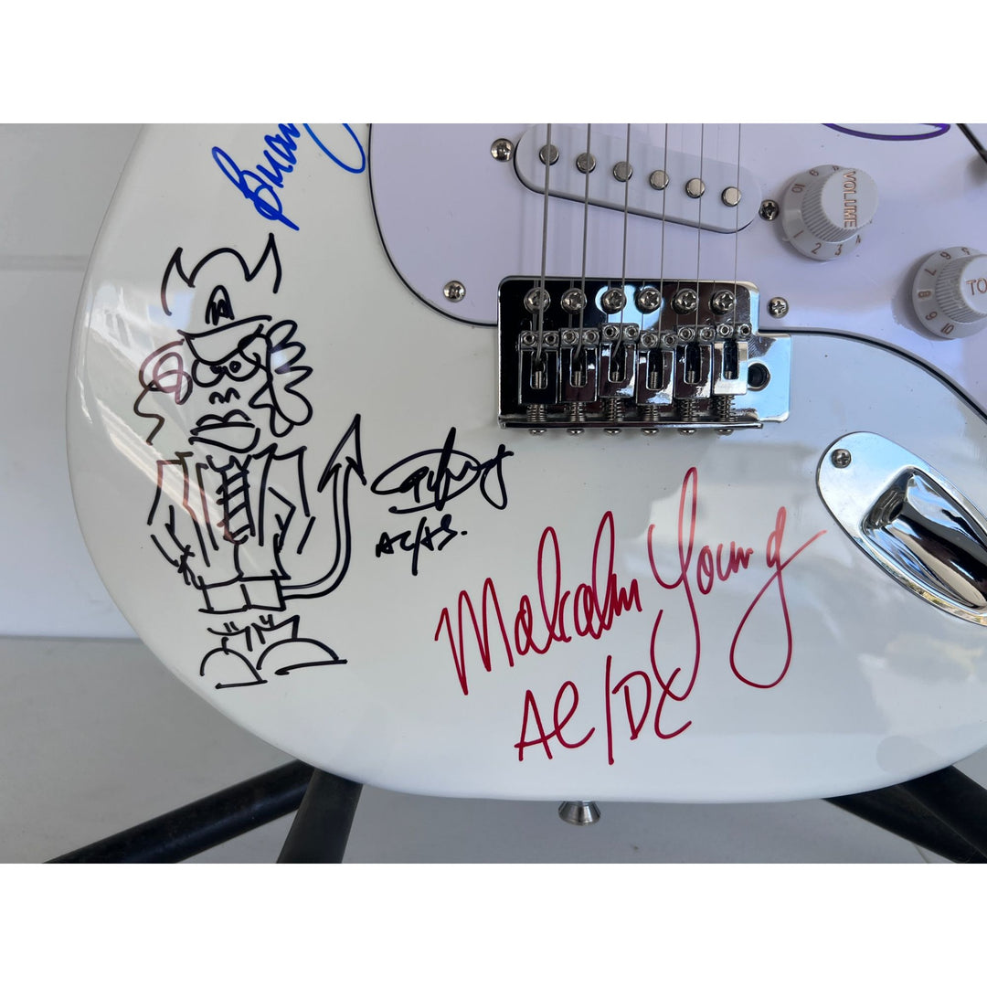 AC-DC Angus Young & Malcolm Young Brian Johnston Cliff Williams Phil Rudd electric guitar signed with proof.