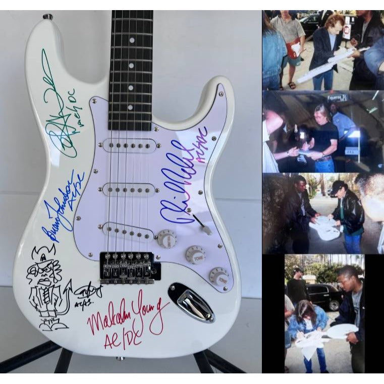 AC-DC Angus Young & Malcolm Young Brian Johnston Cliff Williams Phil Rudd electric guitar signed with proof.