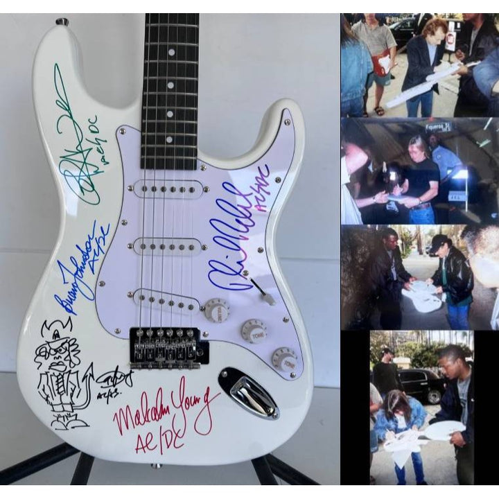 AC-DC Angus Young & Malcolm Young Brian Johnston Cliff Williams Phil Rudd electric guitar signed with proof.
