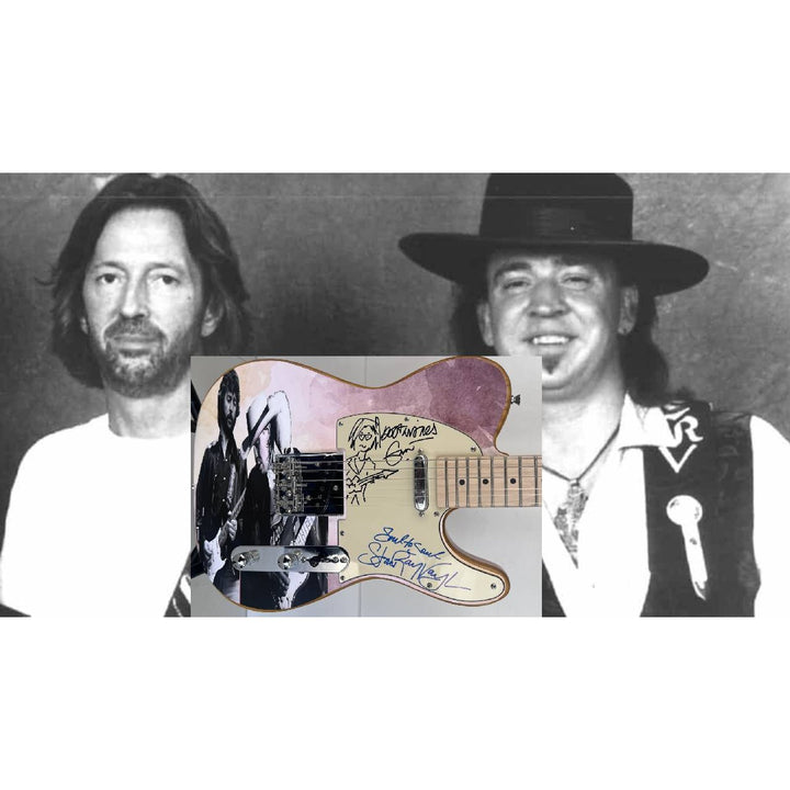 Eric Clapton and Stevie Ray Vaughan with hand made sketch and inscription from (Stevie)  one of a kind full size electric guitar signed.