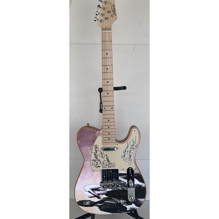 Eric Clapton and Stevie Ray Vaughan with hand made sketch and inscription from (Stevie)  one of a kind full size electric guitar signed.