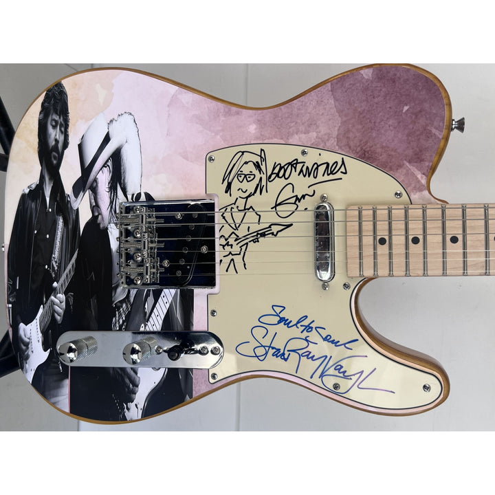Eric Clapton and Stevie Ray Vaughan with hand made sketch and inscription from (Stevie)  one of a kind full size electric guitar signed.