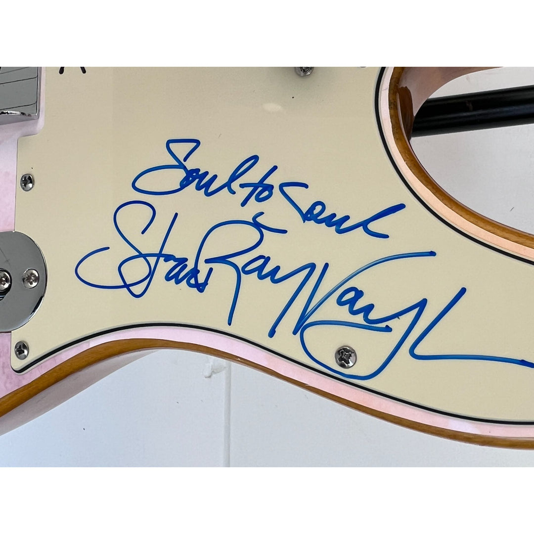 Eric Clapton and Stevie Ray Vaughan with hand made sketch and inscription from (Stevie)  one of a kind full size electric guitar signed.