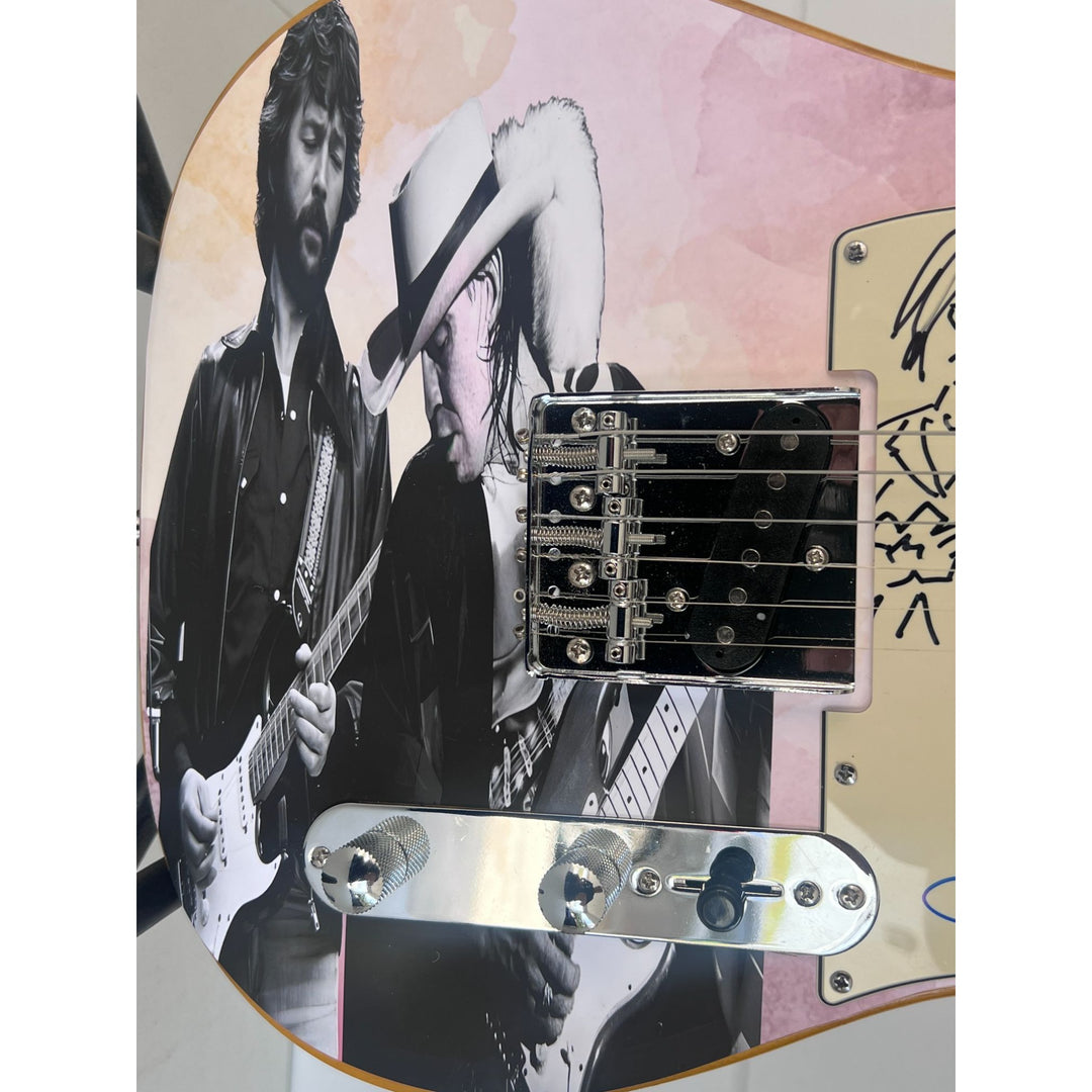 Eric Clapton and Stevie Ray Vaughan with hand made sketch and inscription from (Stevie)  one of a kind full size electric guitar signed.