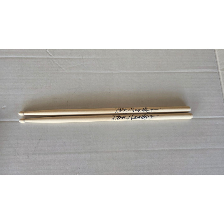 Don Henley The Eagles pair of drumsticks signed with proof.