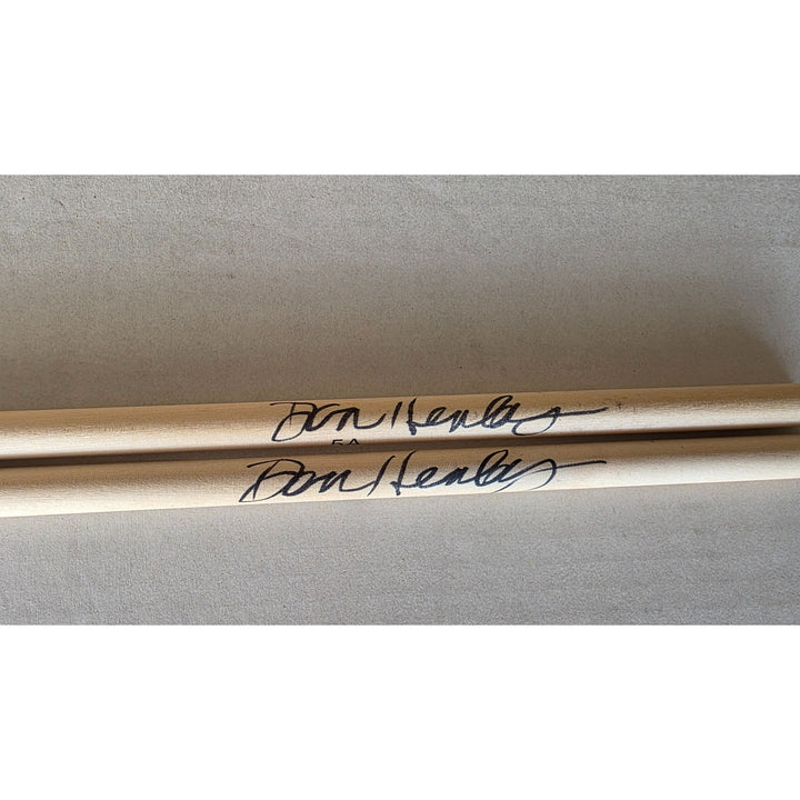 Don Henley The Eagles pair of drumsticks signed with proof.