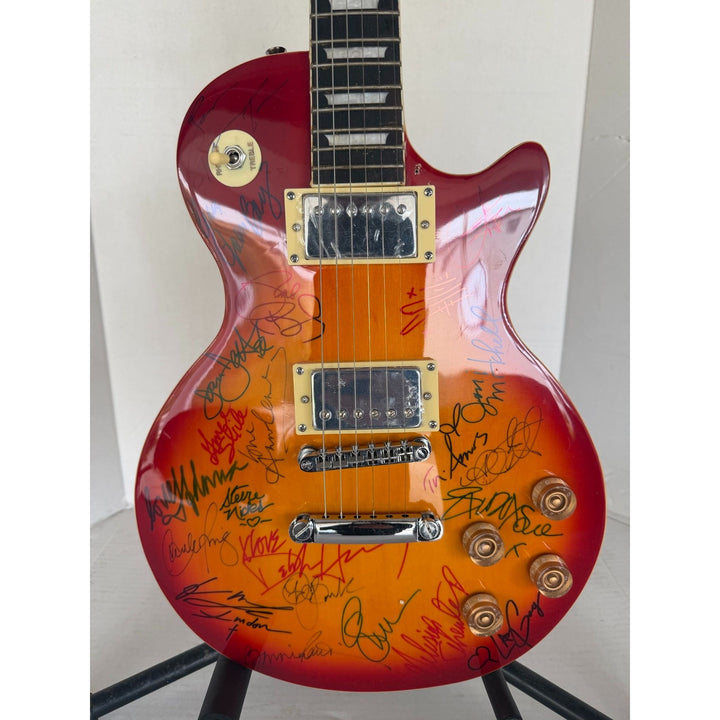 Madonna Tina Turner Stevie Nicks 20 plus women of rock full size Cherry Les Paul electric guitar signed with proof.