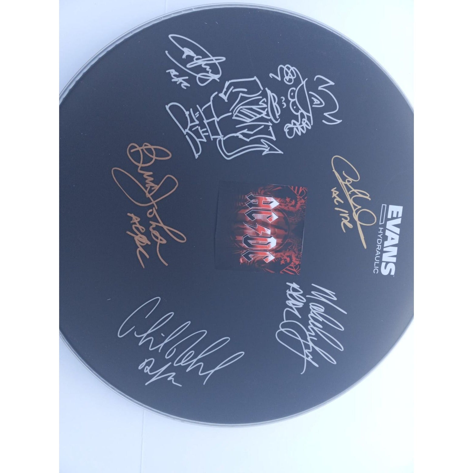 AC/DC Angus & Malcolm Young, Brian Johnson, Phil Rudd, Cliff Williams 14-in Evans drum head signed with proof