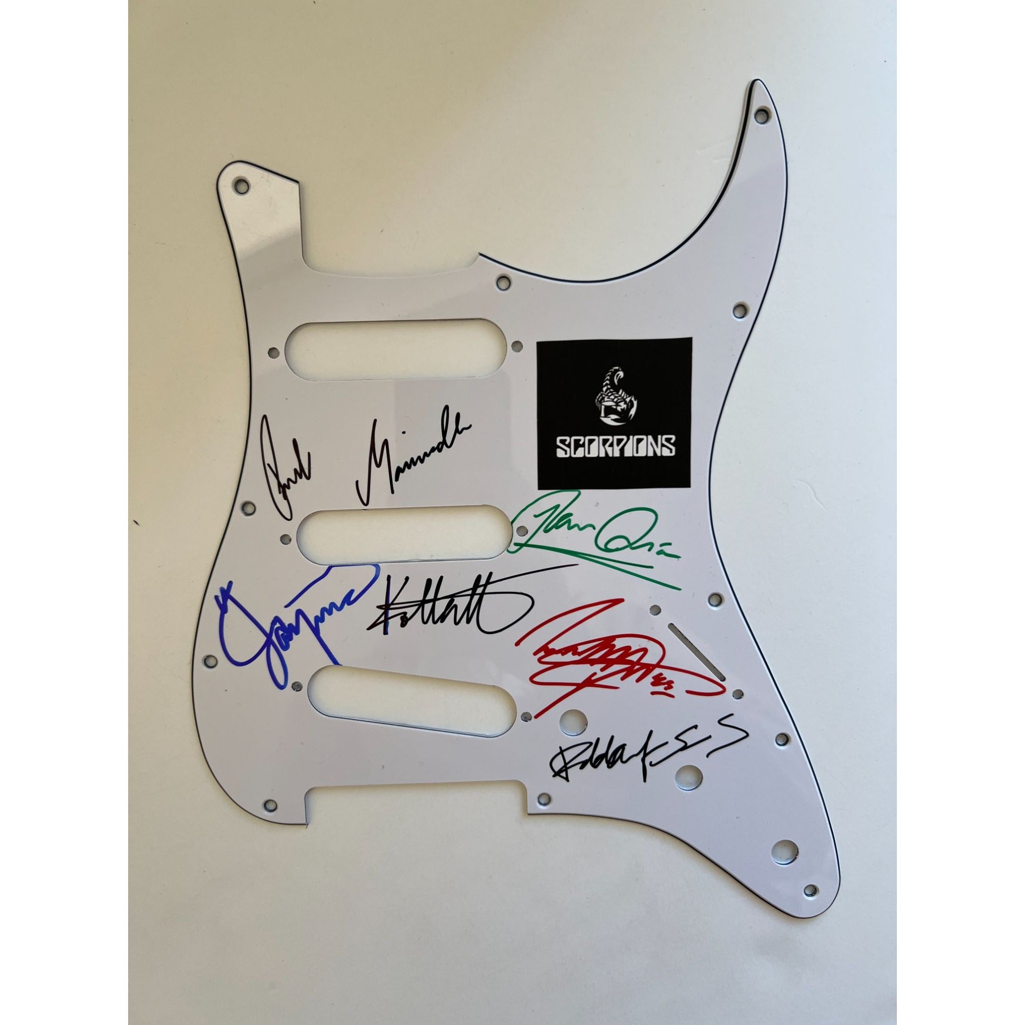 The Scorpions  Klaus Meine, Rudolf Schenker, Matthias Jabs ,James Kottak and Michael Schenker electric guitar pickguard signed