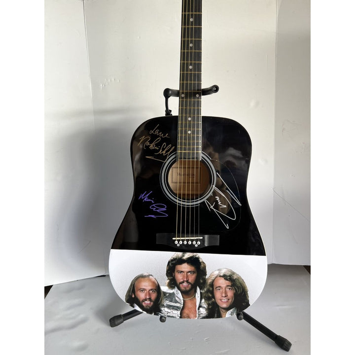 Barry, Robin and Maurice Gibb the Bee Gees Huntington 39' acoustic guitar signed with proof