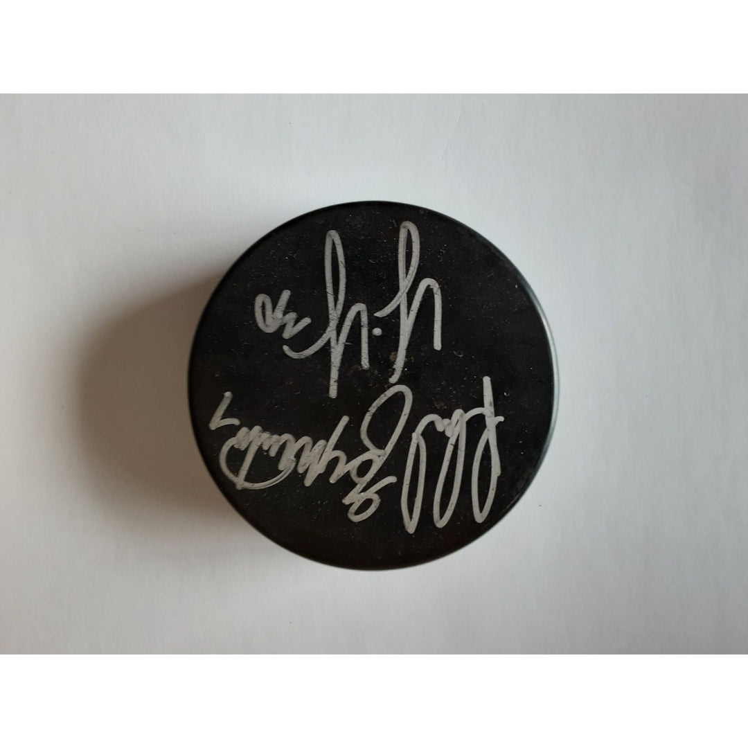 Phil Esposito and Tim Thomas Boston Bruins signed hockey puck - Awesome Artifacts 