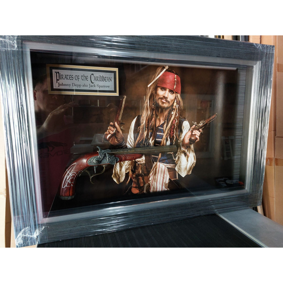 Johnny Depp Pirates of the Caribbean Jack Sparrow original flintlock Pirate pistol signed and framed (27x19x3.5) with proof