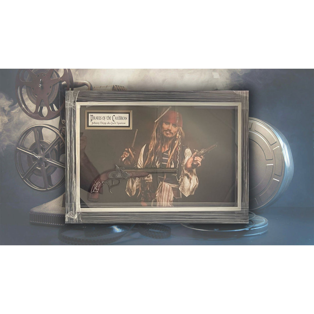 Johnny Depp Pirates of the Caribbean Jack Sparrow original flintlock Pirate pistol signed and framed (27x19x3.5) with proof