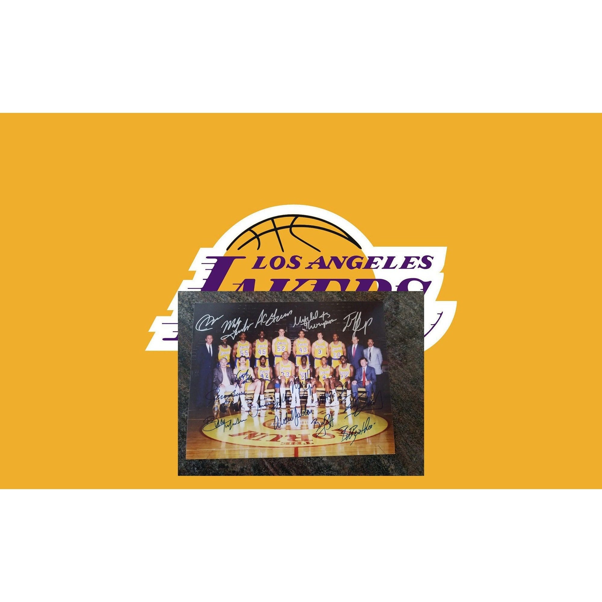 Los Angeles Lakers Earvin Magic Johnson, James Worthy, Jerry Buss team-signed 11 by 14 photo
