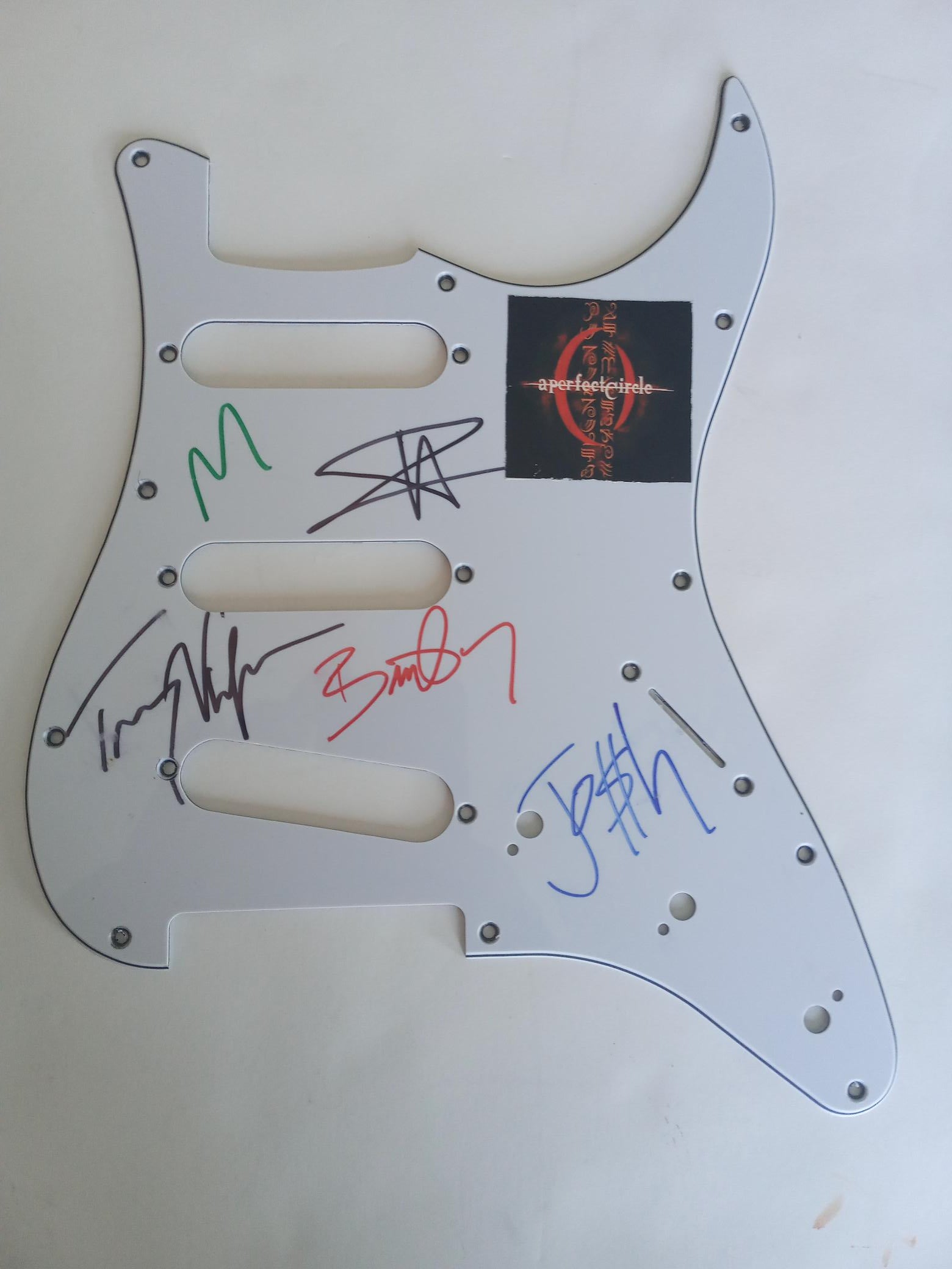 A Perfect Circle Maynard James Keenan, Adam Jones, Danny Carey, Justin Chancellor guitar pickguard signed with proof