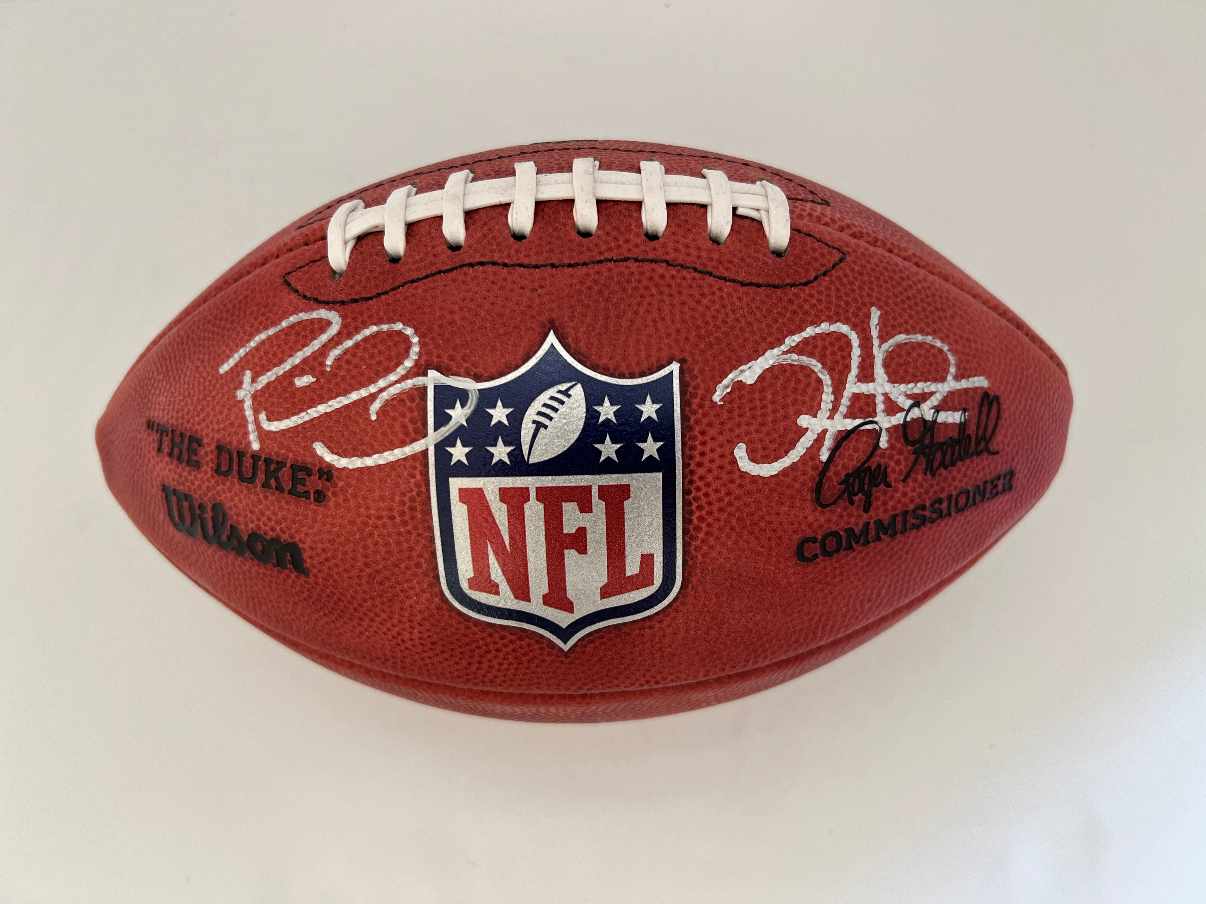 Patrick Mahomes and Jalen Hurts NFL Wilson Leather authentic game model football signed with proof with free acrylic display case
