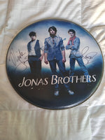 Load image into Gallery viewer, The Jonas Brothers 14 inch drum head signed with proof
