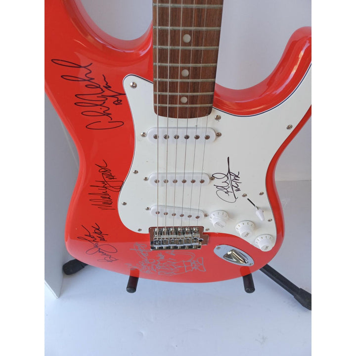 Angus Young, Malcolm Young, Phil Rudd, Brian Johnson and Cliff Williams AC/DC Fender electric guitar signed with proof