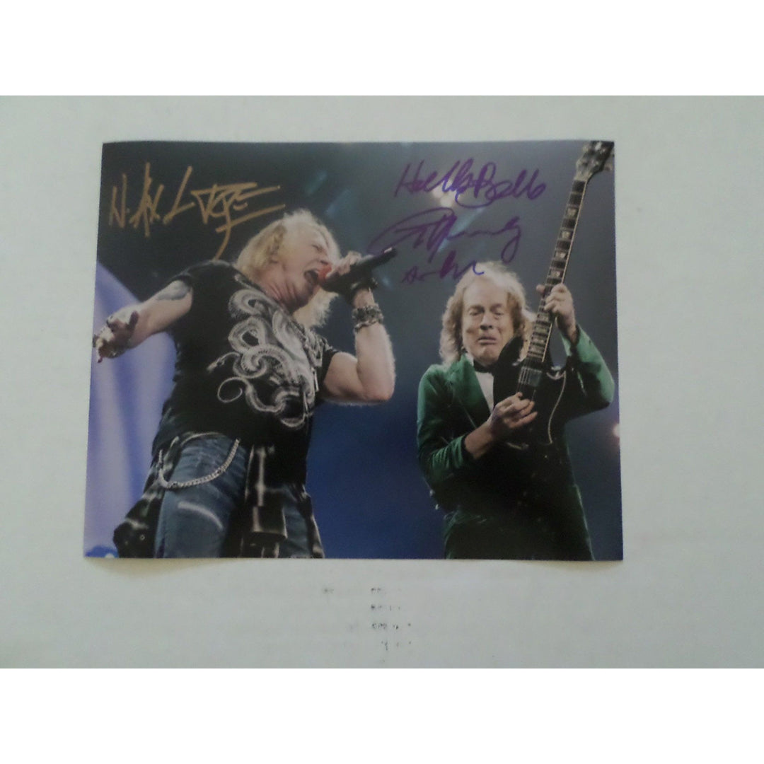 Axl Rose and Angus Young 8 by 10 signed photo with proof