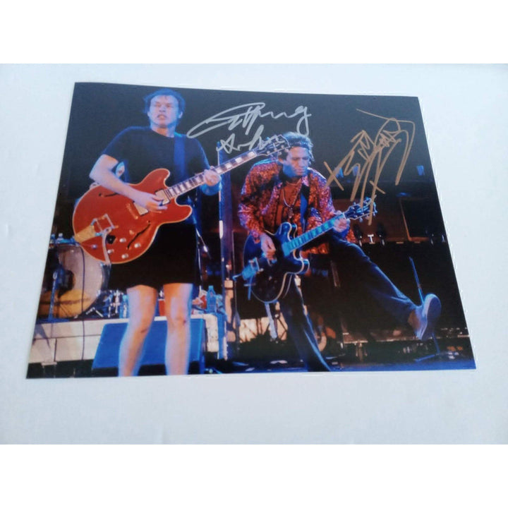 Angus Young and Keith Richards 8 by 10 signed photo with proof