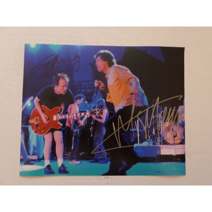 Angus Young and Mick Jagger 8 by 10 signed photo with proof