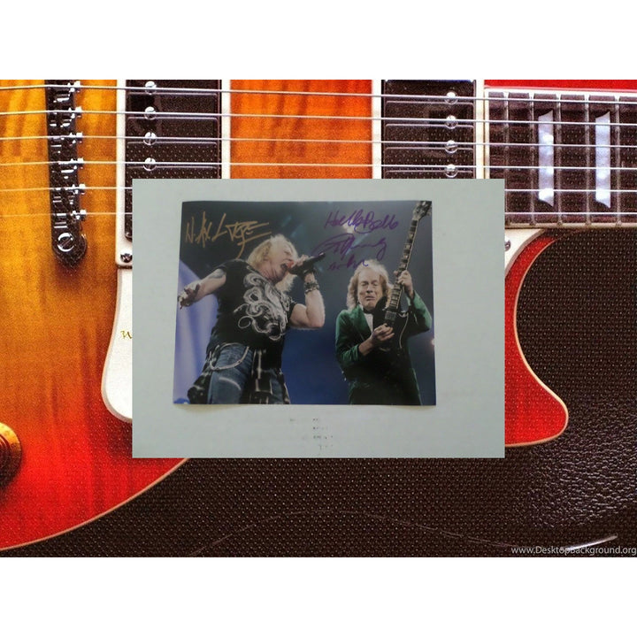 Axl Rose and Angus Young 8 by 10 signed photo with proof